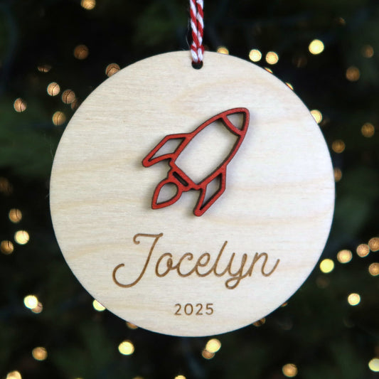Wood Engraved Rocket Ship Personalized Kids Name Christmas Ornament 2025 or Unique Christmas space themed stocking tag for kids handmade by Moon Rock Prints