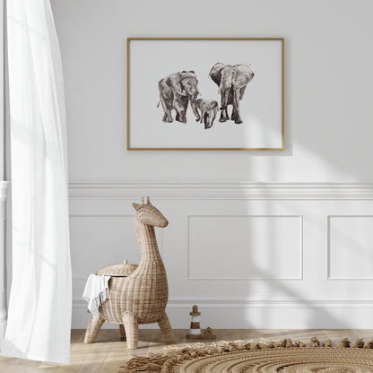 Framed artwork of elephants on a wall in a playroom. 
