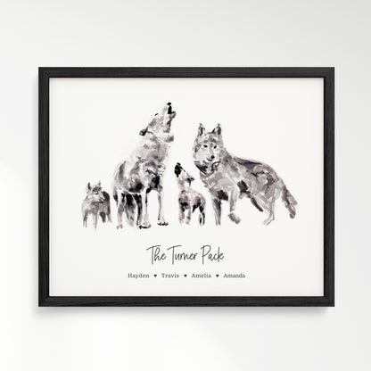 Personalized Wolf Family of 4 Watercolor Art Print framed in a black wood frame by Moon Rock Prints