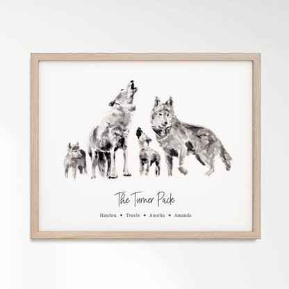 Personalized Wolf Family of 4 Watercolor Art Print framed in a light oak wood frame by Moon Rock Prints