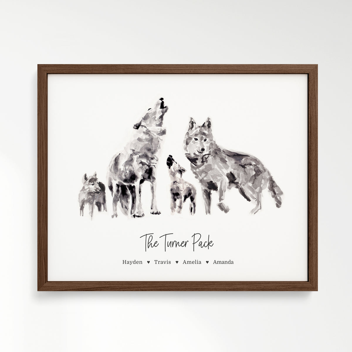Personalized Wolf Family of 4 Watercolor Art Print framed in a walnut wood frame by Moon Rock Prints