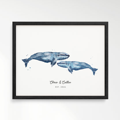 Framed artwork of two blue whales on a white background in black frame