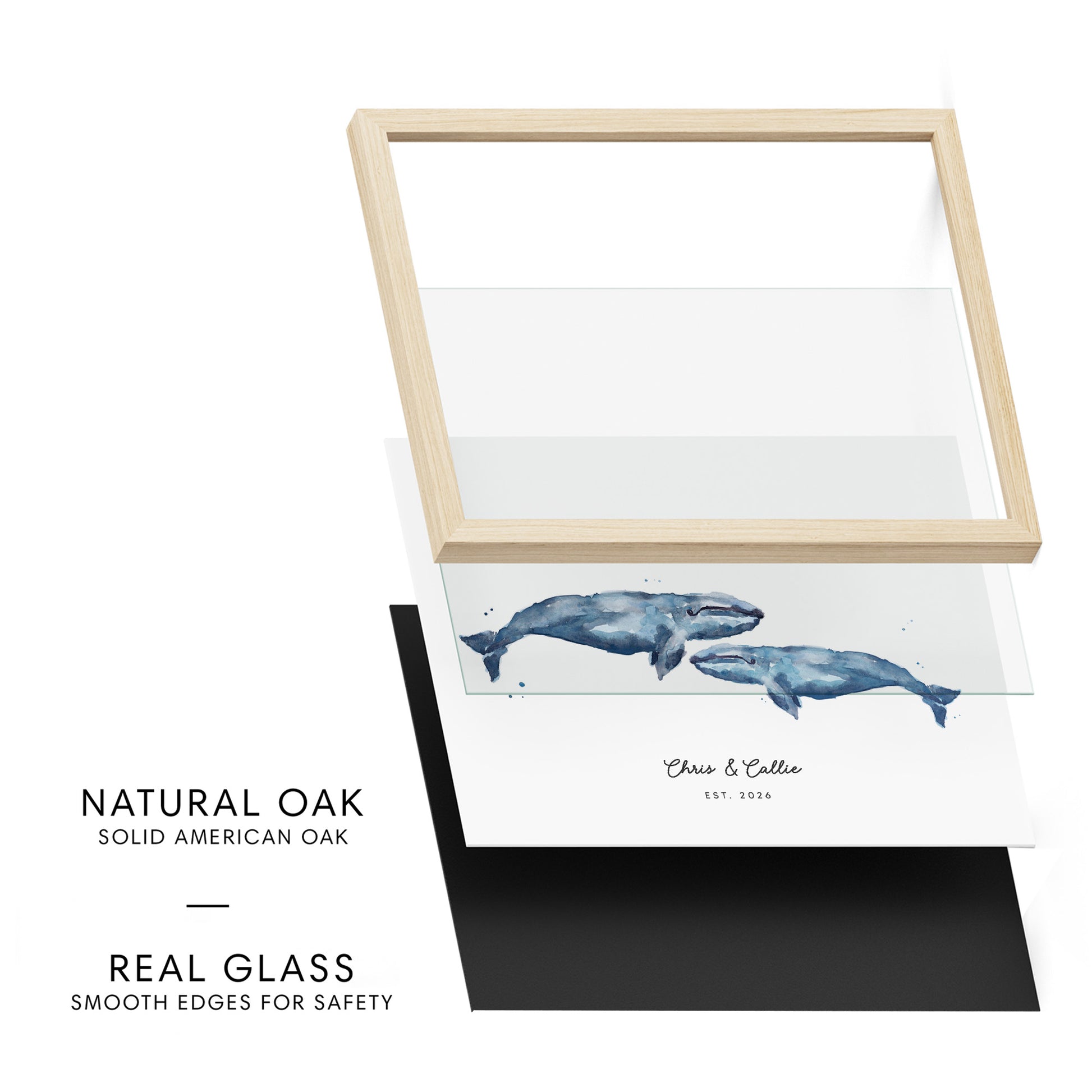 Framed artwork with whales on a white background, featuring natural oak frame and real glass.