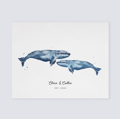 Watercolor illustration of two whales with personalized text on a light background