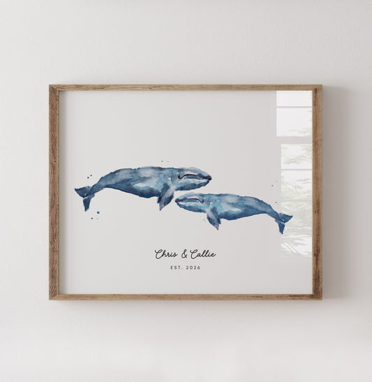 Framed artwork of two whales on a white background